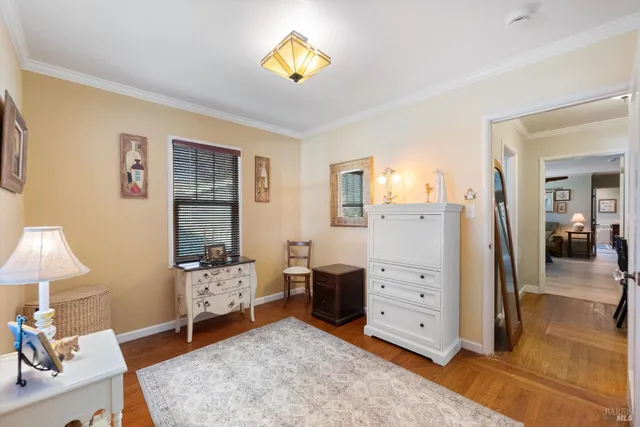 a bed room with a bed and dresser