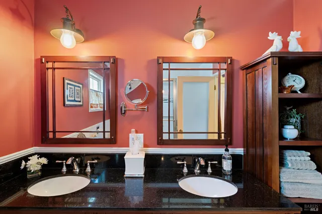 a view of a balcony with chairs and potted plants