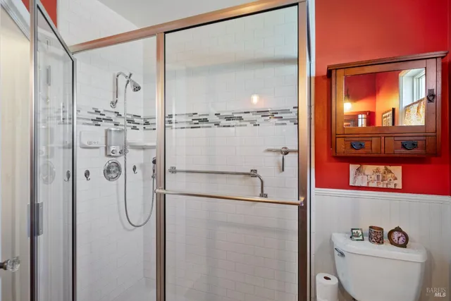 a front view of a house with a iron gate