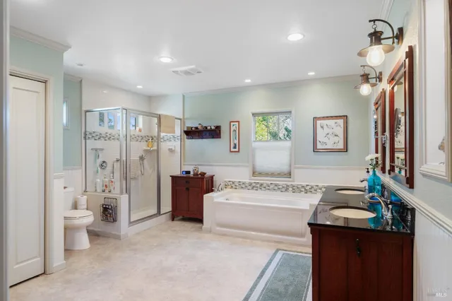 a kitchen with a table chairs refrigerator and microwave