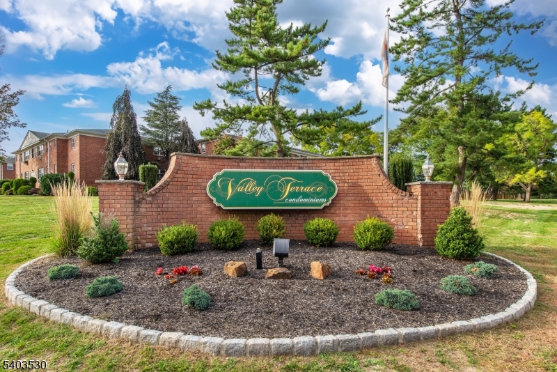 1130 Valley Road, Unit 2A Wayne, NJ 07470 - Photo 14 of 19 a view of a garden with a fountain
