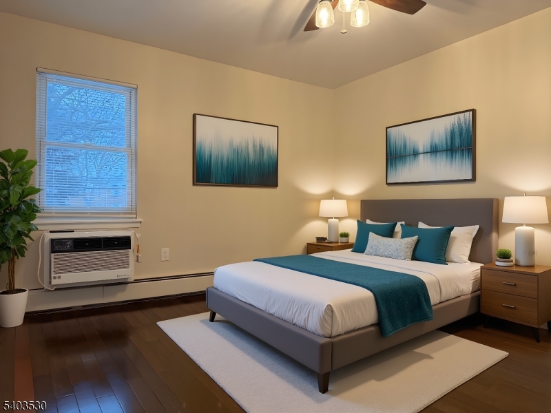 1130 Valley Road, Unit 2A Wayne, NJ 07470 - Photo 5 of 19 a bedroom with a bed and a ceiling fan