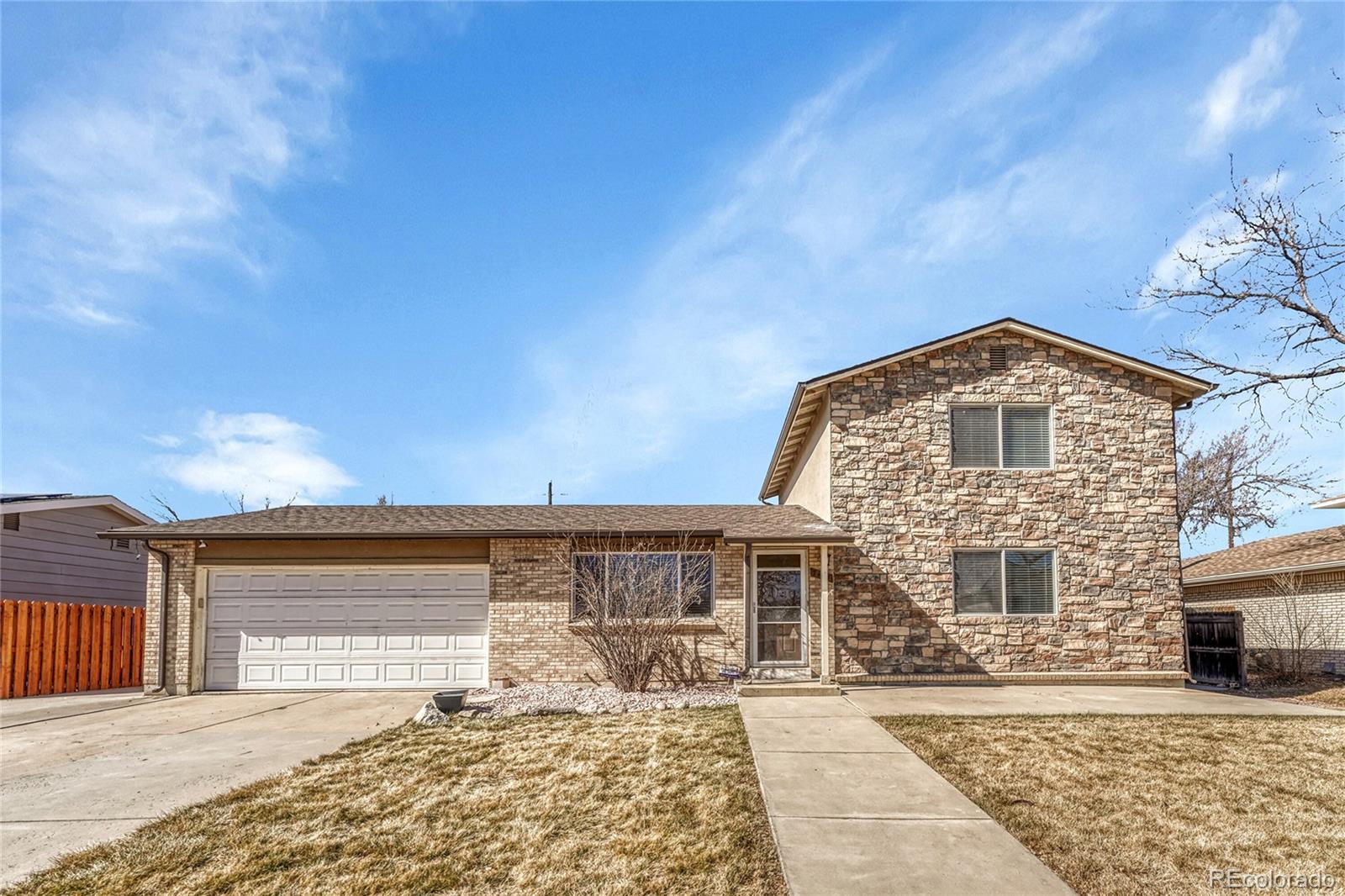 7461 Webster Street Arvada, CO 80003 - Photo 1 of 31 a front view of a house