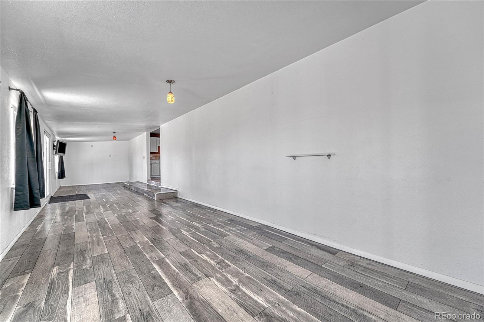 7461 Webster Street Arvada, CO 80003 - Photo 11 of 31 a view of empty room