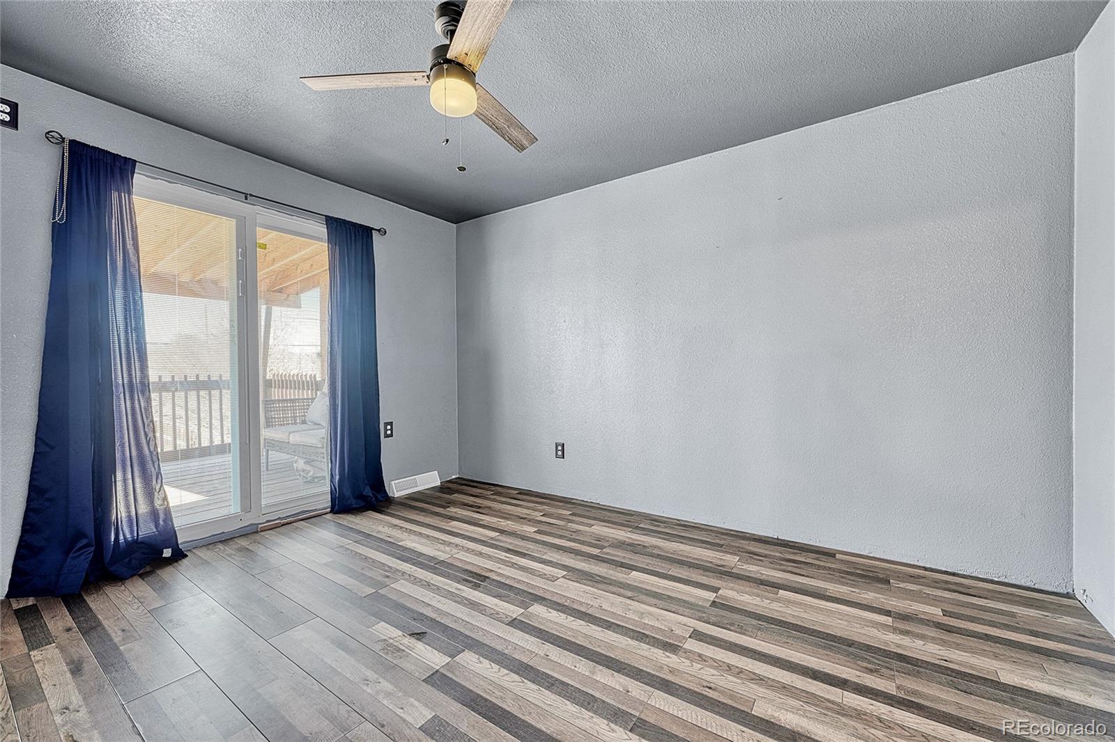 7461 Webster Street Arvada, CO 80003 - Photo 18 of 31 a view of an empty room with a window