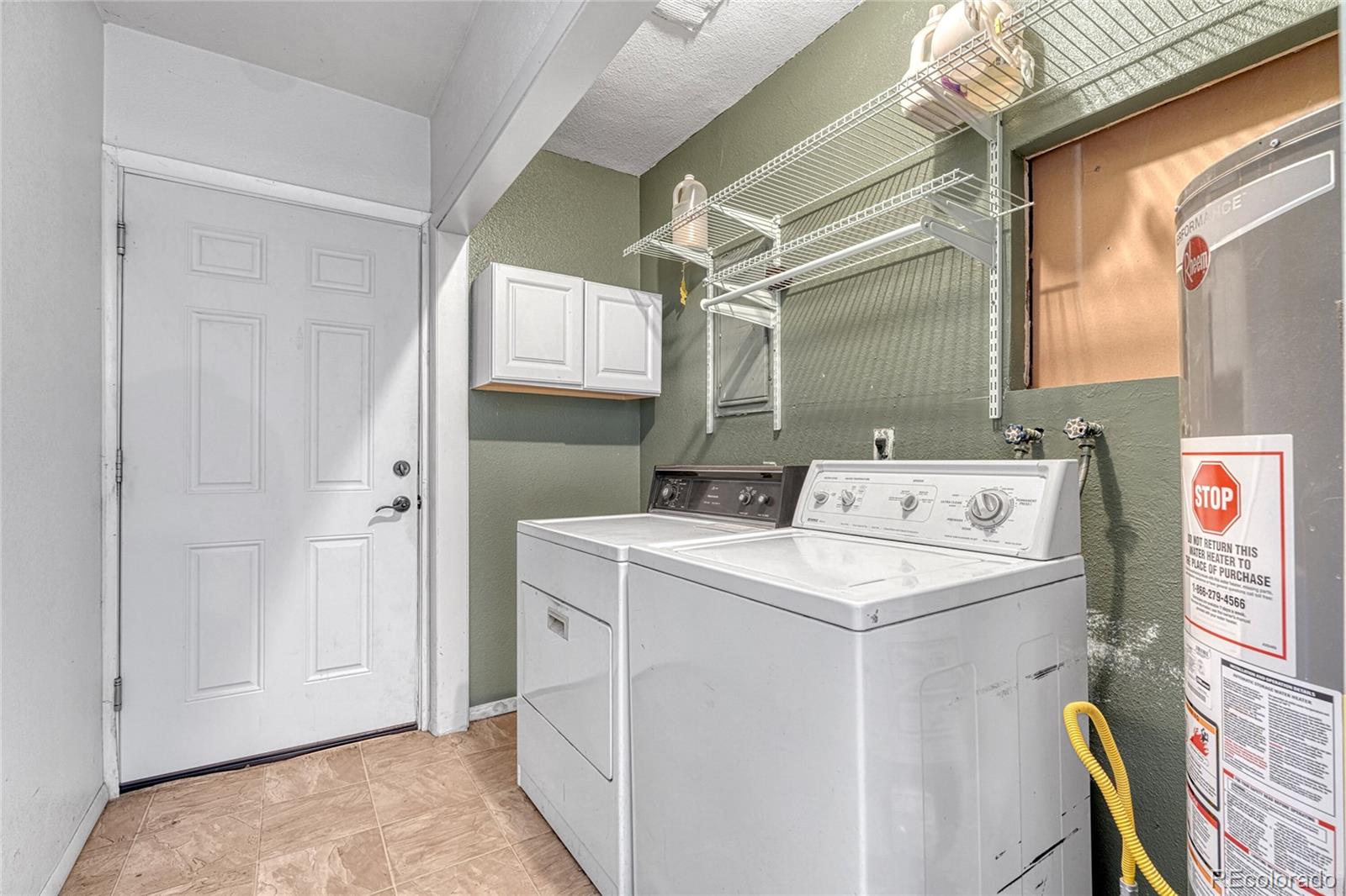 7461 Webster Street Arvada, CO 80003 - Photo 23 of 31 a utility room with dryer and washer