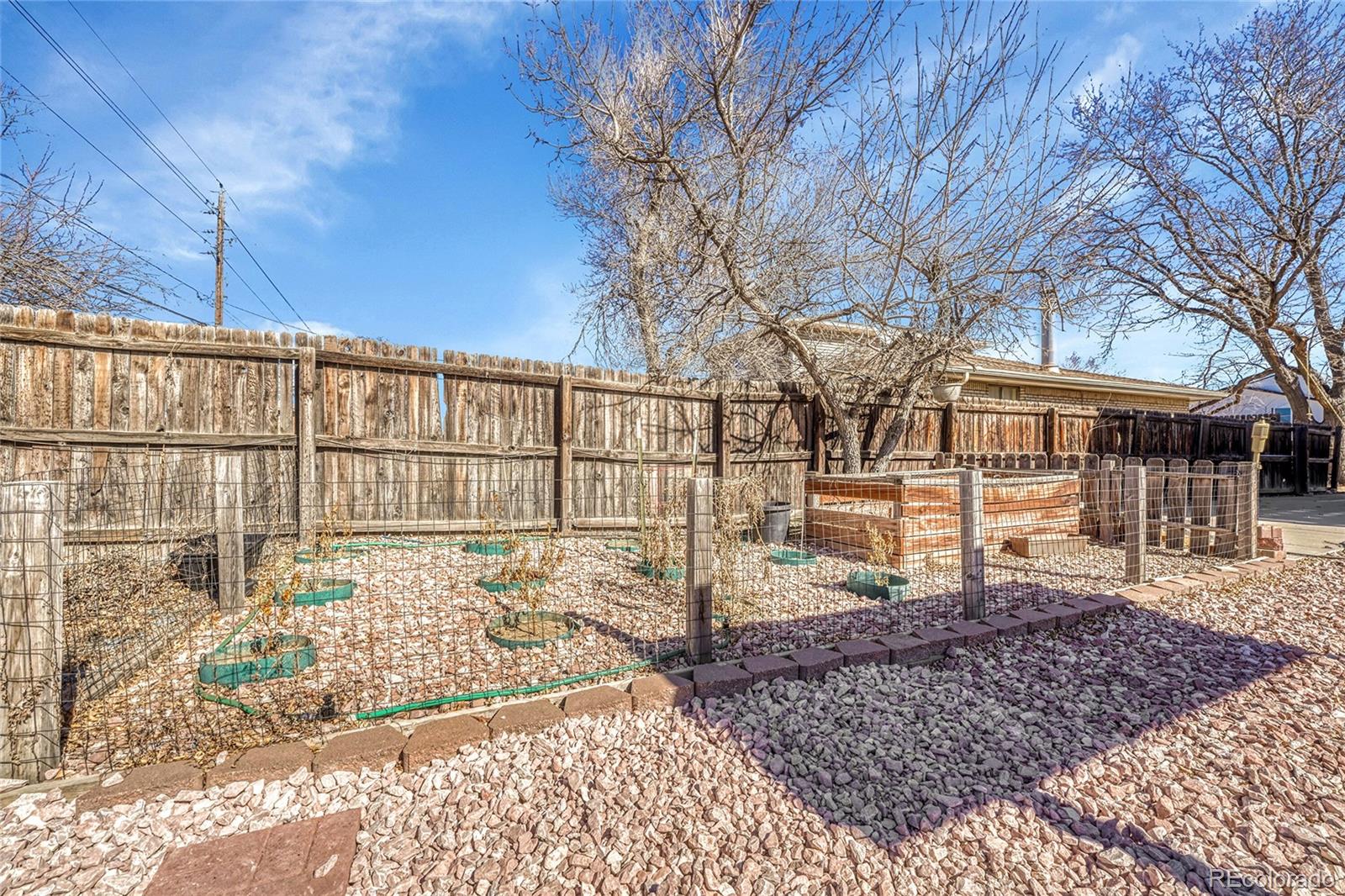 7461 Webster Street Arvada, CO 80003 - Photo 27 of 31 a view of a yard with wooden fence