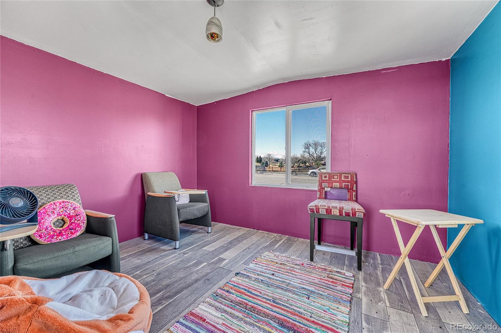 7461 Webster Street Arvada, CO 80003 - Photo 29 of 31 a bedroom with a bed and a table