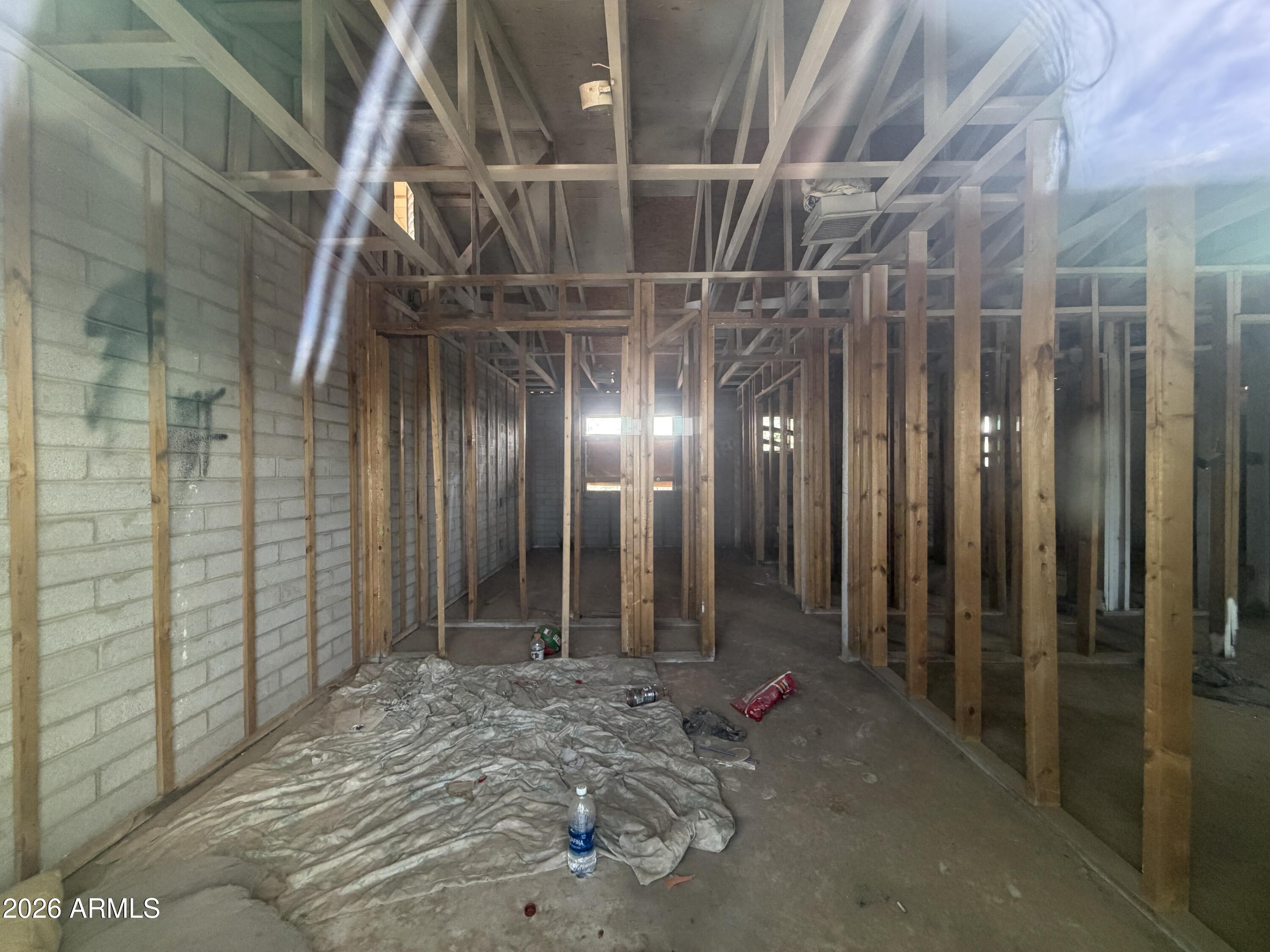 231 West Rhodes Avenue Avondale, AZ 85323 - Photo 6 of 7 a view of a room with wooden walls