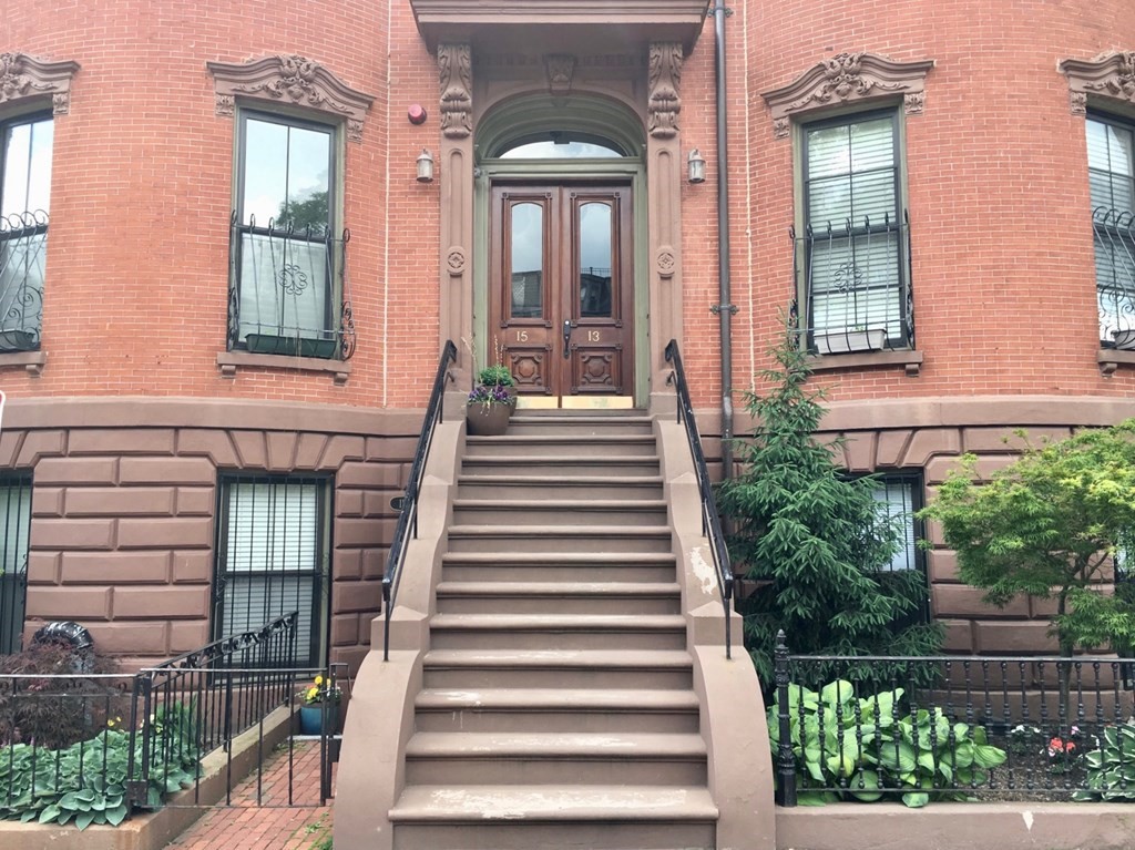 a view of a building with a window and stairs