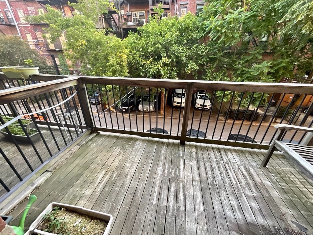 13 Worcester Square, Unit 2 Boston, MA 02118 - Photo 15 of 16 a view of deck with wooden floor and outdoor seating