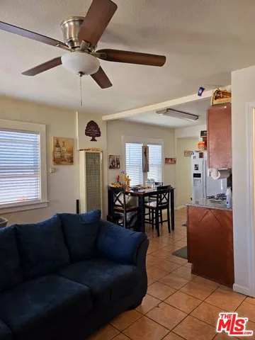 a view of hallway with stairs and wooden floor