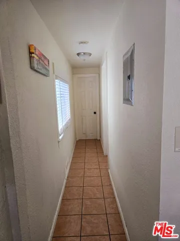 a white toilet sitting next to a window