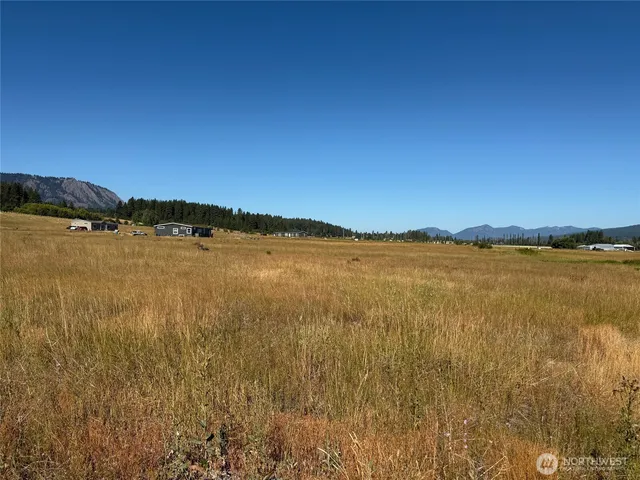 a view of a town with mountains in the background