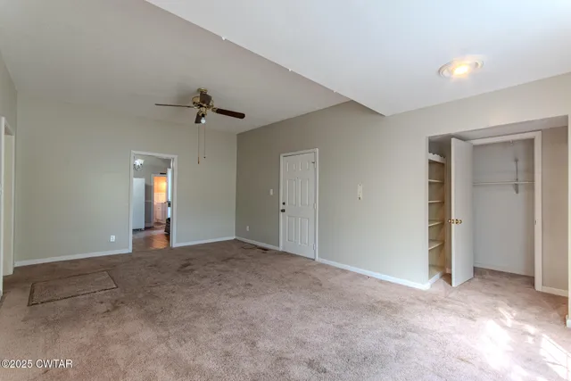 a bathroom with a tub sink and window