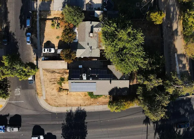 a view of a room with wooden floor