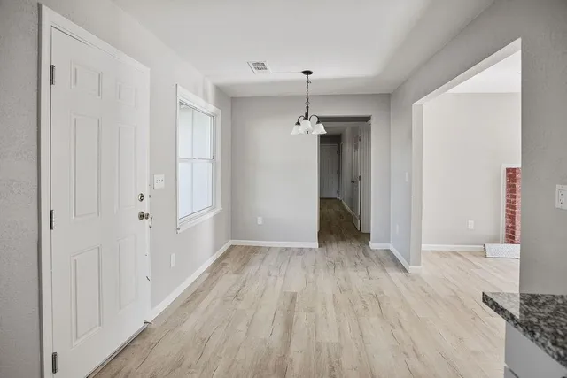 a kitchen with stainless steel appliances granite countertop a stove microwave and sink