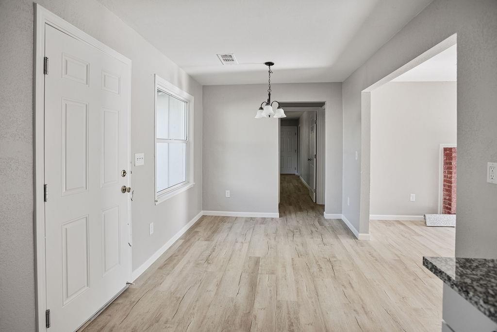 2525 R Street Merced, CA 95340 - Photo 6 of 12 a view of a room with wooden floor