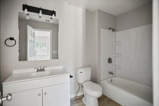 a view of large yard with large trees