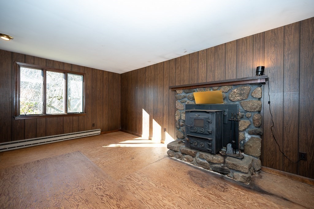 31 Cemetery Street Mendon, MA 01756 - Photo 11 of 39 an empty room with windows