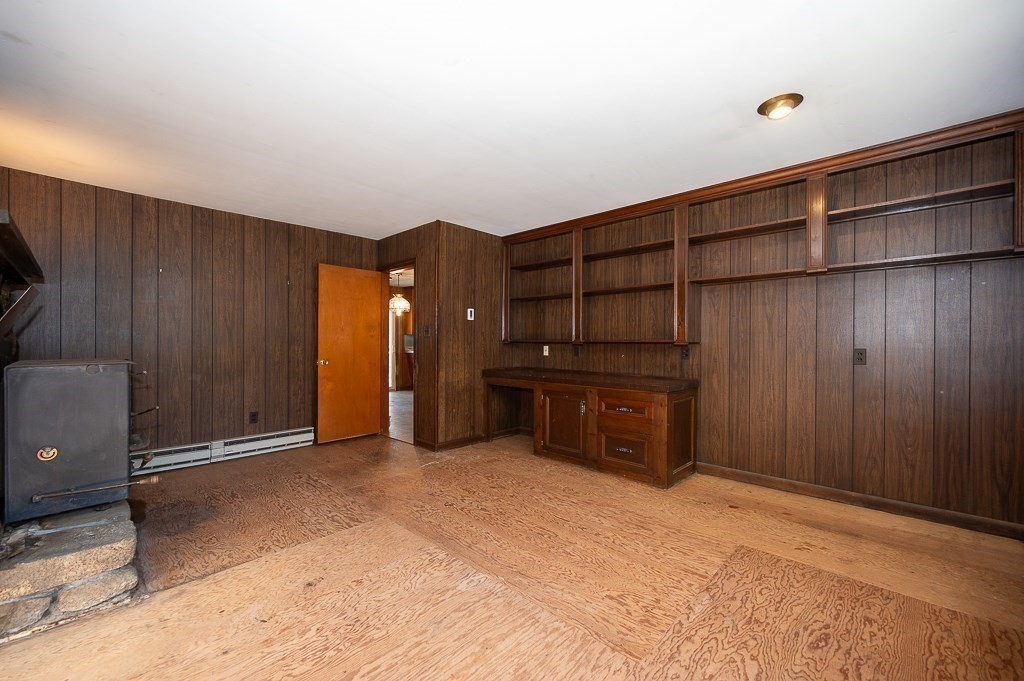 31 Cemetery Street Mendon, MA 01756 - Photo 12 of 39 a view of an empty room with furniture and wooden shelves