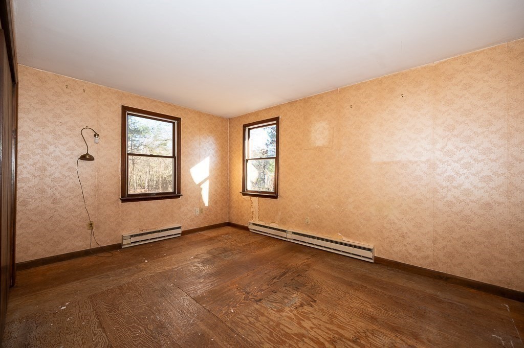 31 Cemetery Street Mendon, MA 01756 - Photo 17 of 39 an empty room with windows