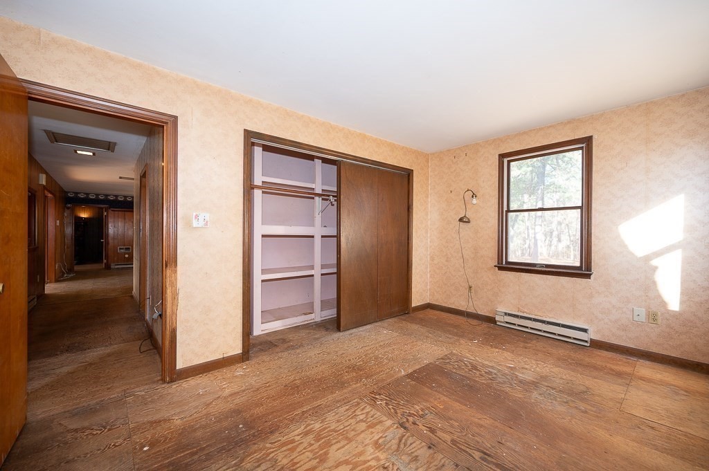 31 Cemetery Street Mendon, MA 01756 - Photo 18 of 39 an empty room with windows and closet