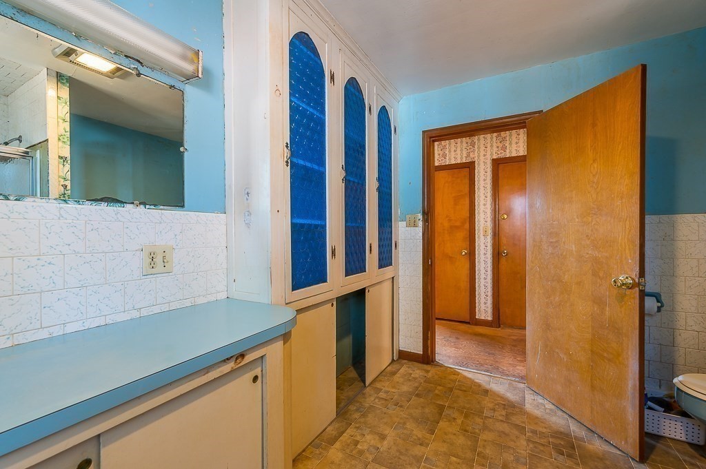 31 Cemetery Street Mendon, MA 01756 - Photo 19 of 39 a view of a bathroom with a sink and a mirror