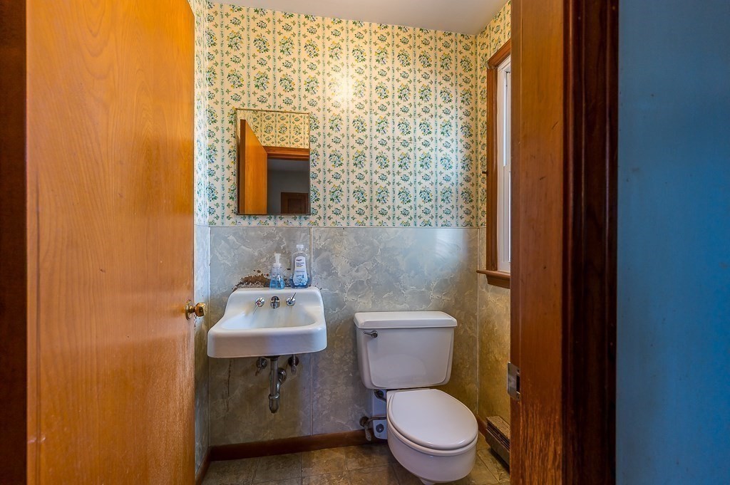 31 Cemetery Street Mendon, MA 01756 - Photo 20 of 39 a bathroom with a sink a toilet and mirror