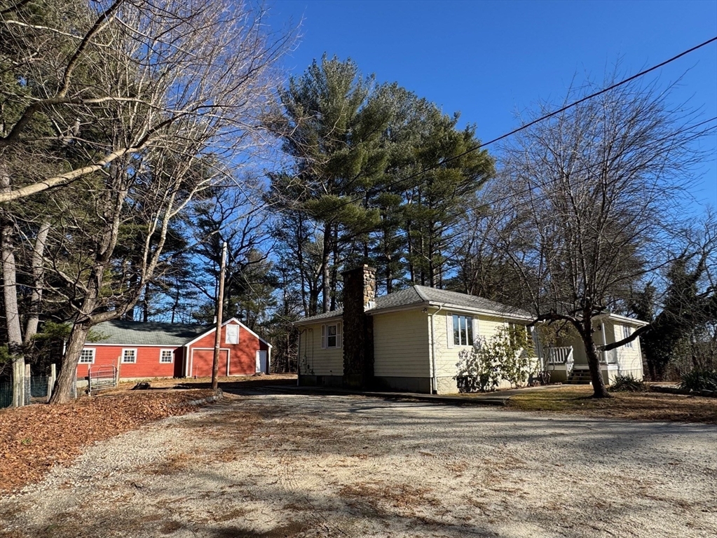 31 Cemetery Street Mendon, MA 01756 - Photo 2 of 39 a view of a house with a yard and garage