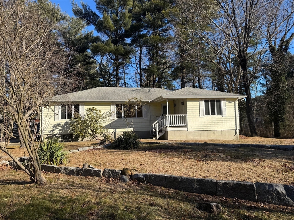 31 Cemetery Street Mendon, MA 01756 - Photo 3 of 39 a front view of a house with a yard