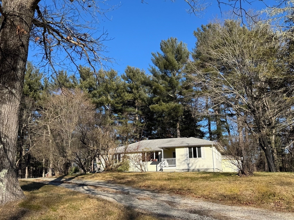 31 Cemetery Street Mendon, MA 01756 - Photo 32 of 39 a view of house with trees in the background