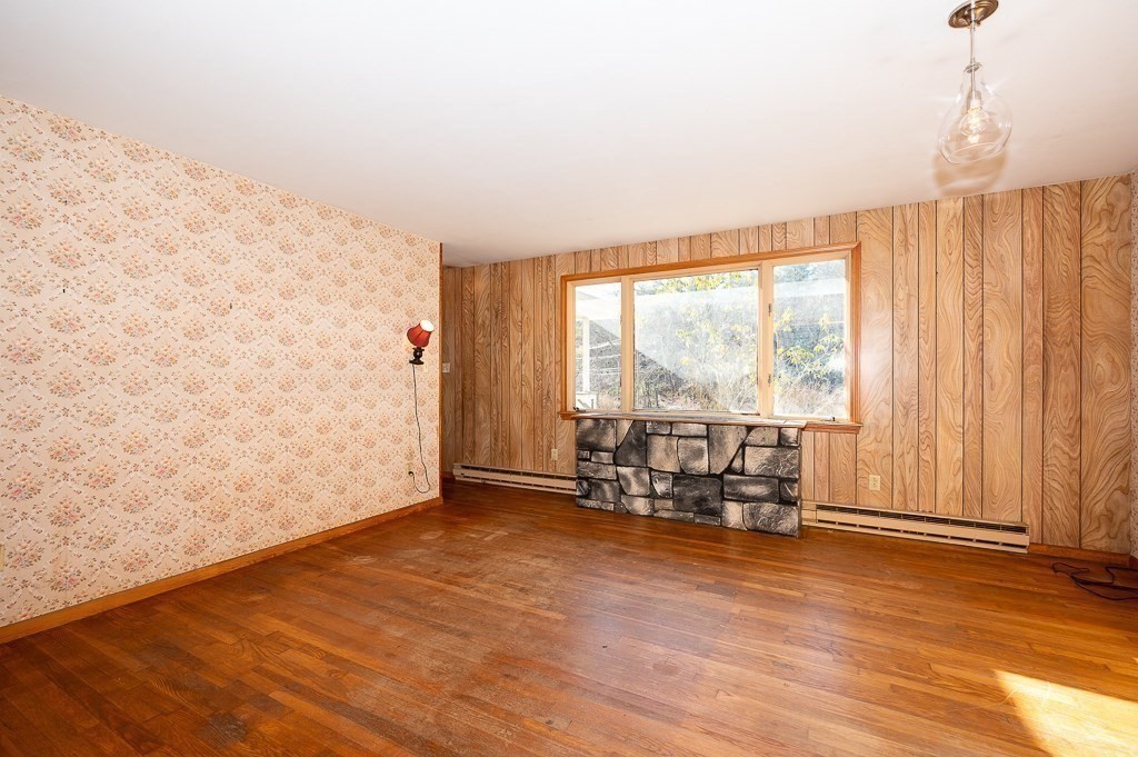 31 Cemetery Street Mendon, MA 01756 - Photo 10 of 39 wooden floor in an empty room with a window