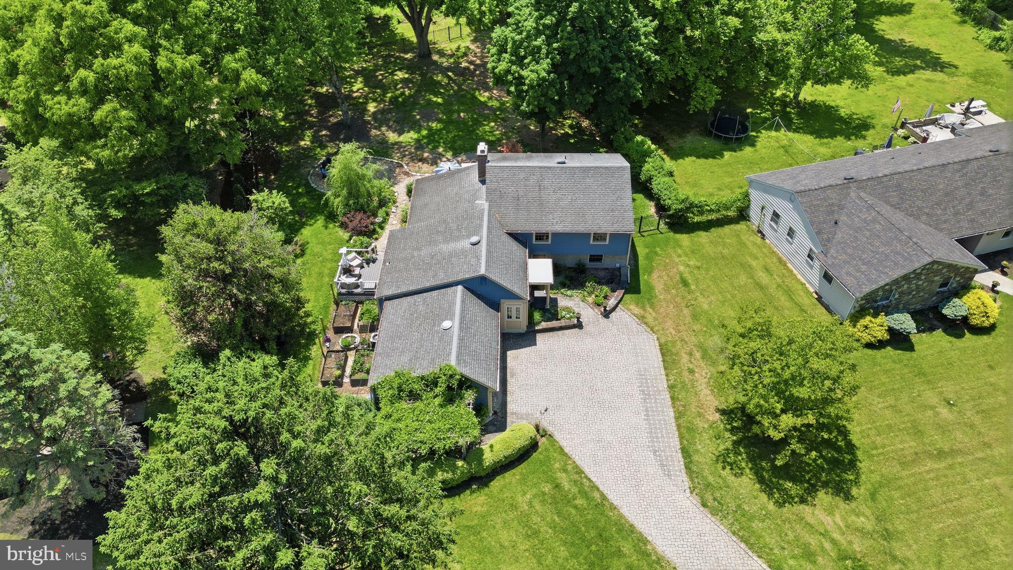 621 River Road Yardley, PA 19067 - Photo 70 of 75 an aerial view of a house with a yard and large trees