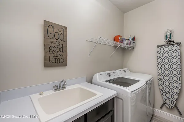 a utility room with dryer and washer