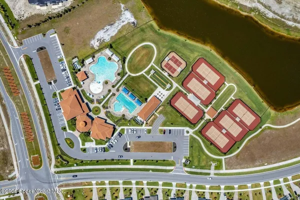 an aerial view of a house with a swimming pool