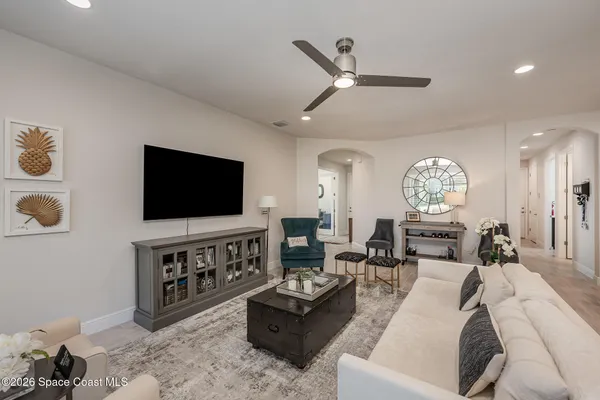a living room with furniture and a flat screen tv