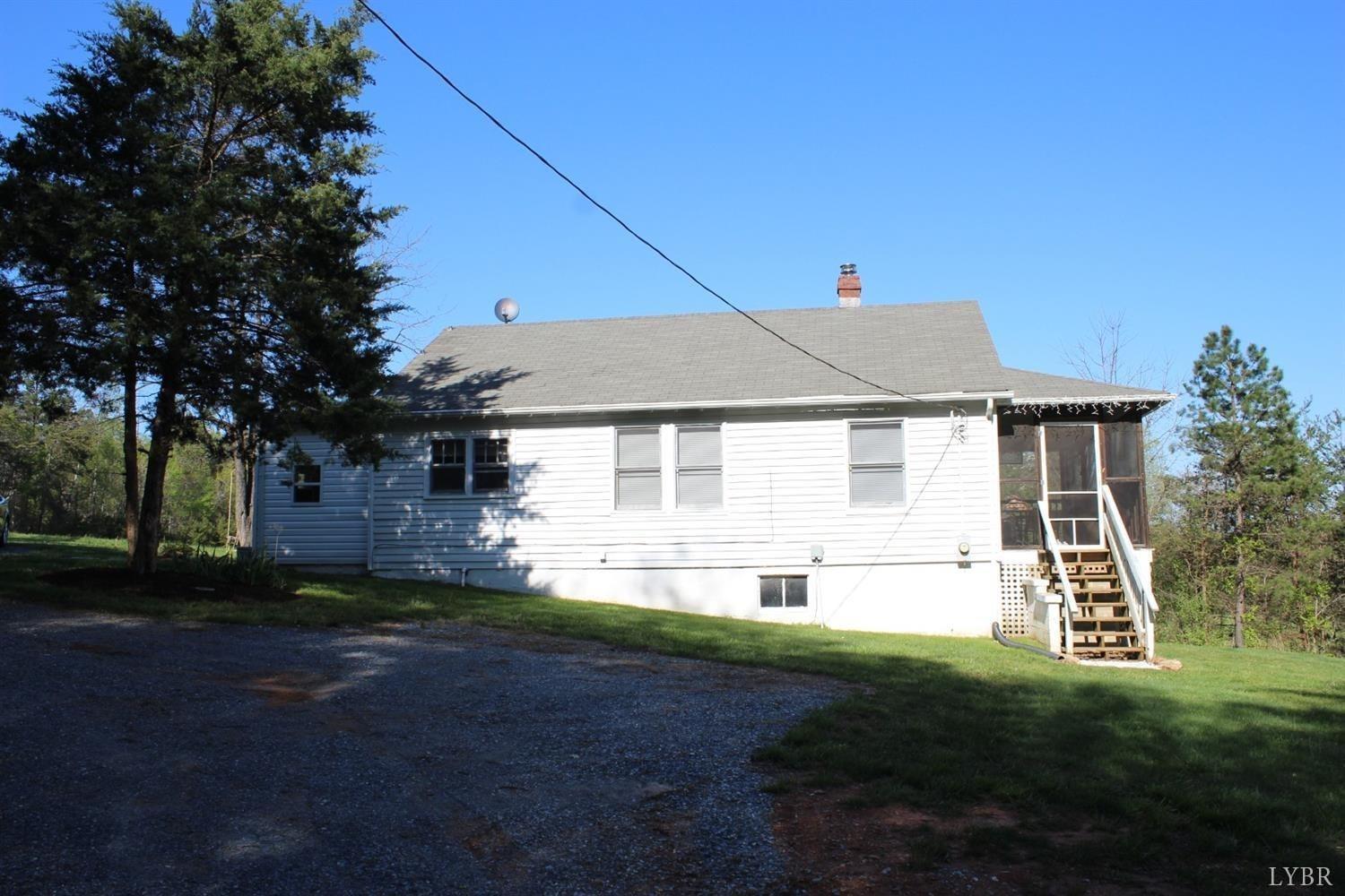 2730 New Chapel Road Rustburg, VA 24588 - Photo 13 of 31 a front view of a house with a yard