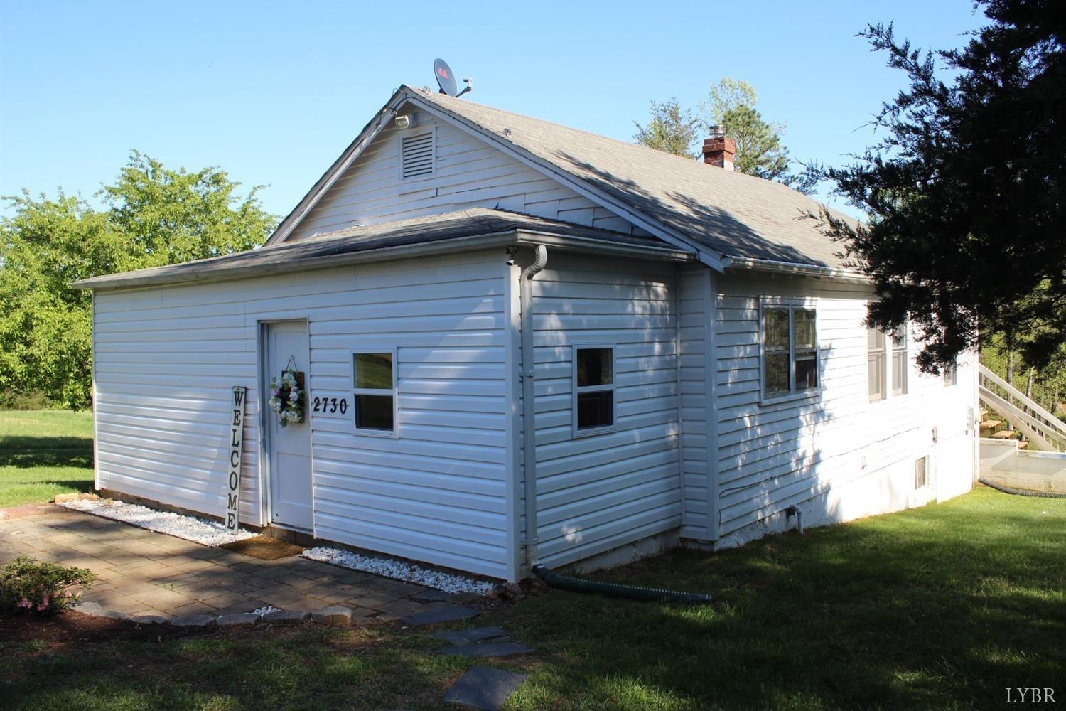 2730 New Chapel Road Rustburg, VA 24588 - Photo 3 of 31 a view of a house with a yard