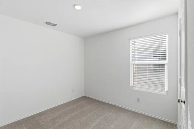 a bathroom with a sink toilet and a mirror