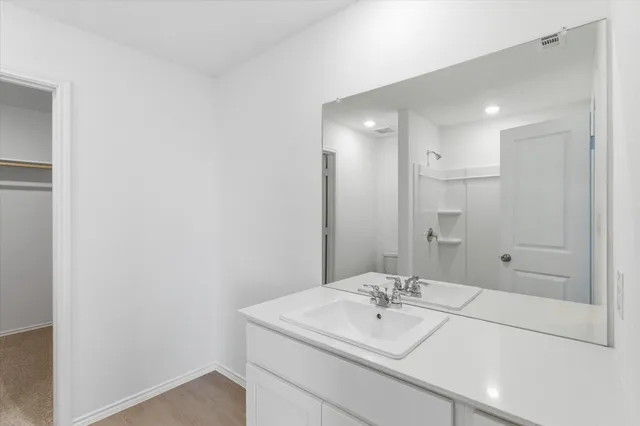 a view of kitchen with furniture and refrigerator