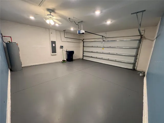 a bathroom with a granite countertop sink and shower