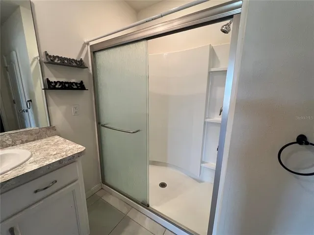 a white toilet sitting next to a sink