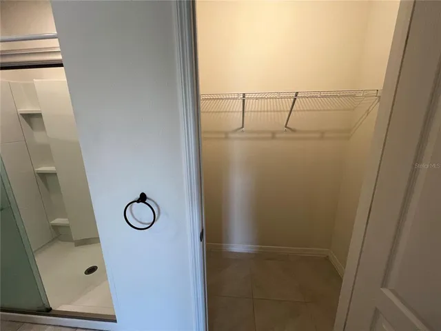 a view of storage and utility room with racks on the wall