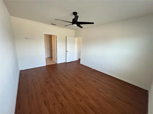 a view of kitchen with refrigerator microwave and stove