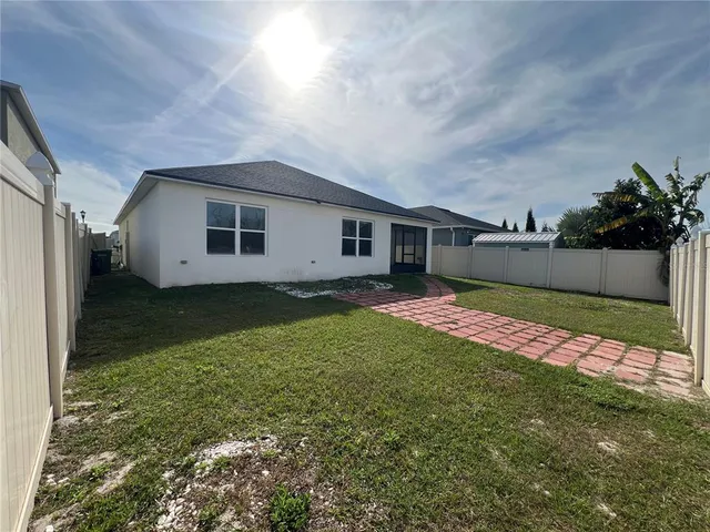 a backyard of a house with lots of green space