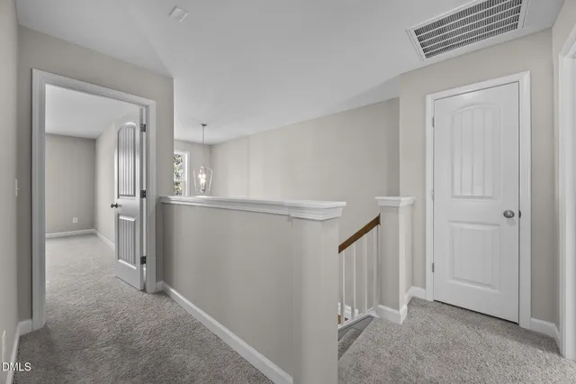 a view of a hallway with closet and entryway