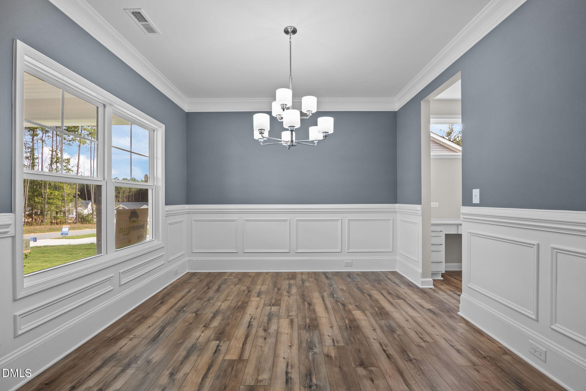 74 Cardovia Way Wendell, NC 27591 - Photo 3 of 34 wooden floor in an empty room with a window