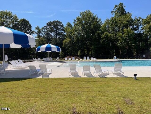 74 Cardovia Way Wendell, NC 27591 - Photo 33 of 34 a view of swimming pool with an outdoor seating