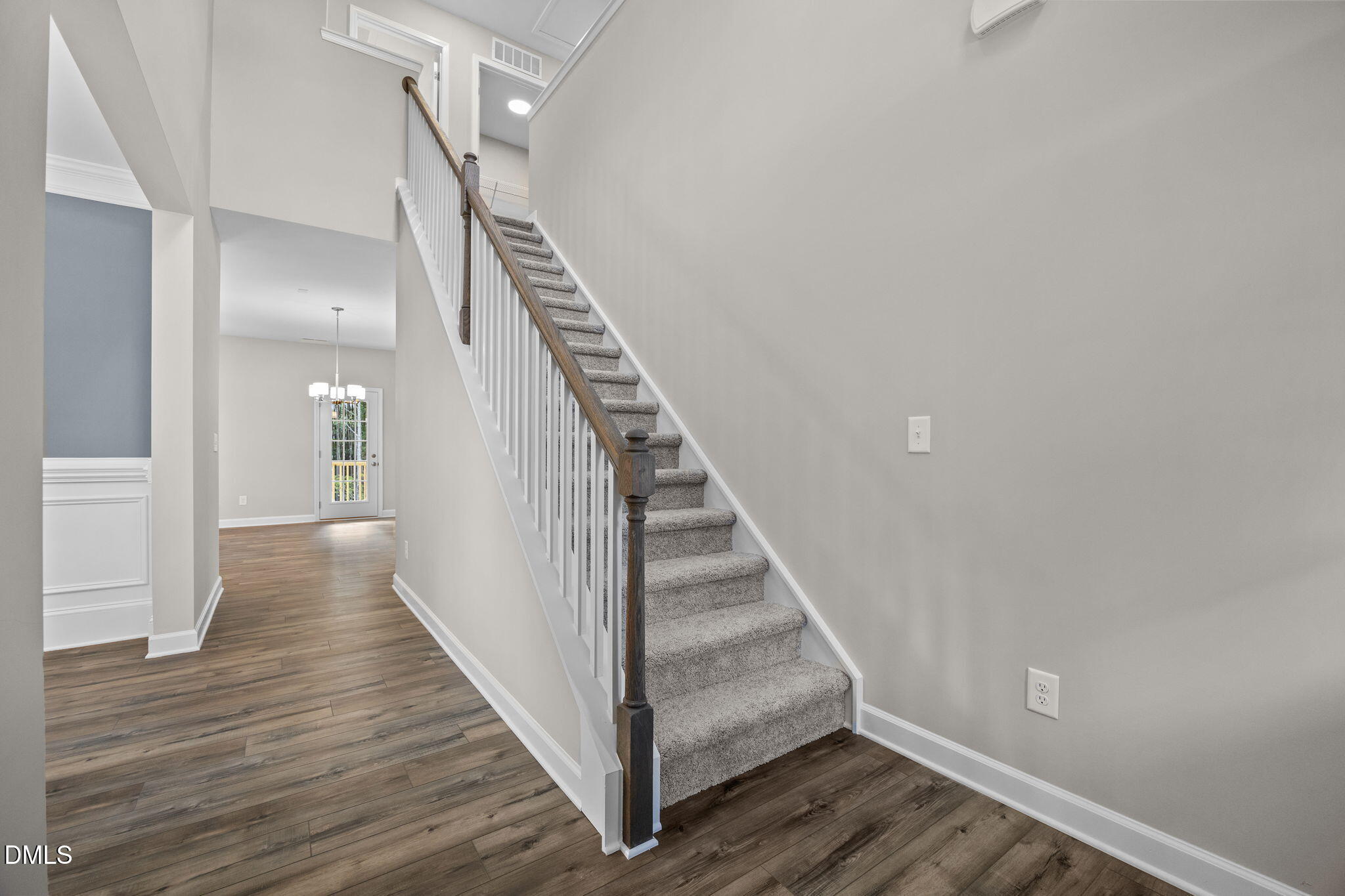 74 Cardovia Way Wendell, NC 27591 - Photo 4 of 34 a view of a hallway with wooden floor and staircase